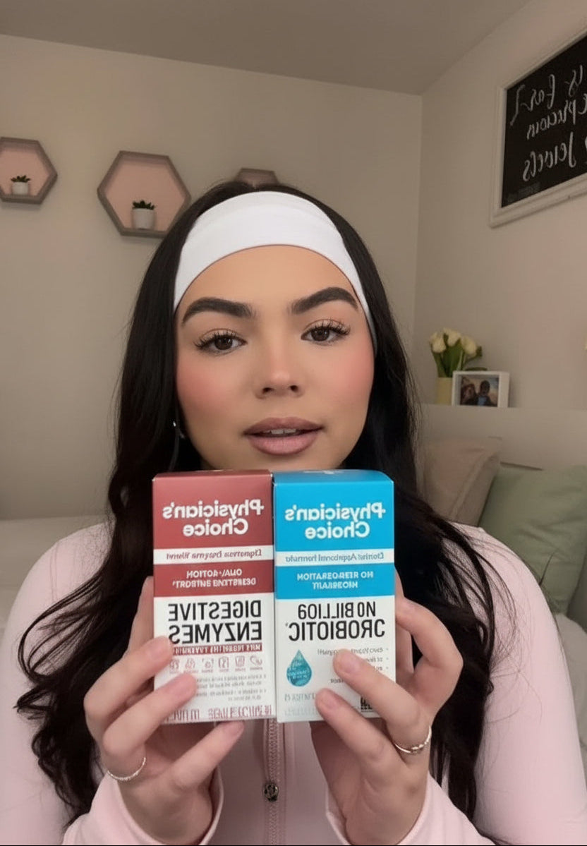 Person holding two Probiotica products in a casual indoor setting